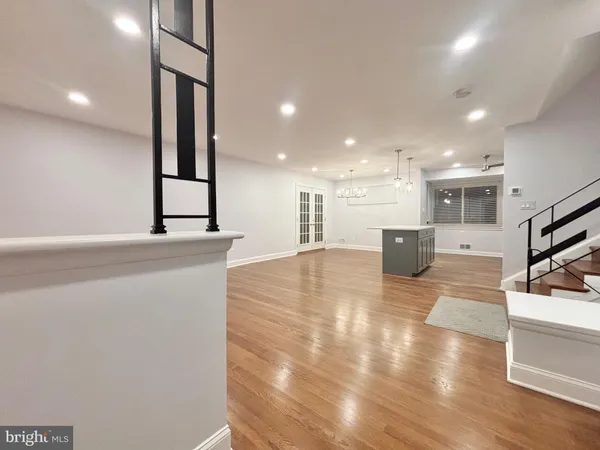 a lobby with a couch and a view of living room