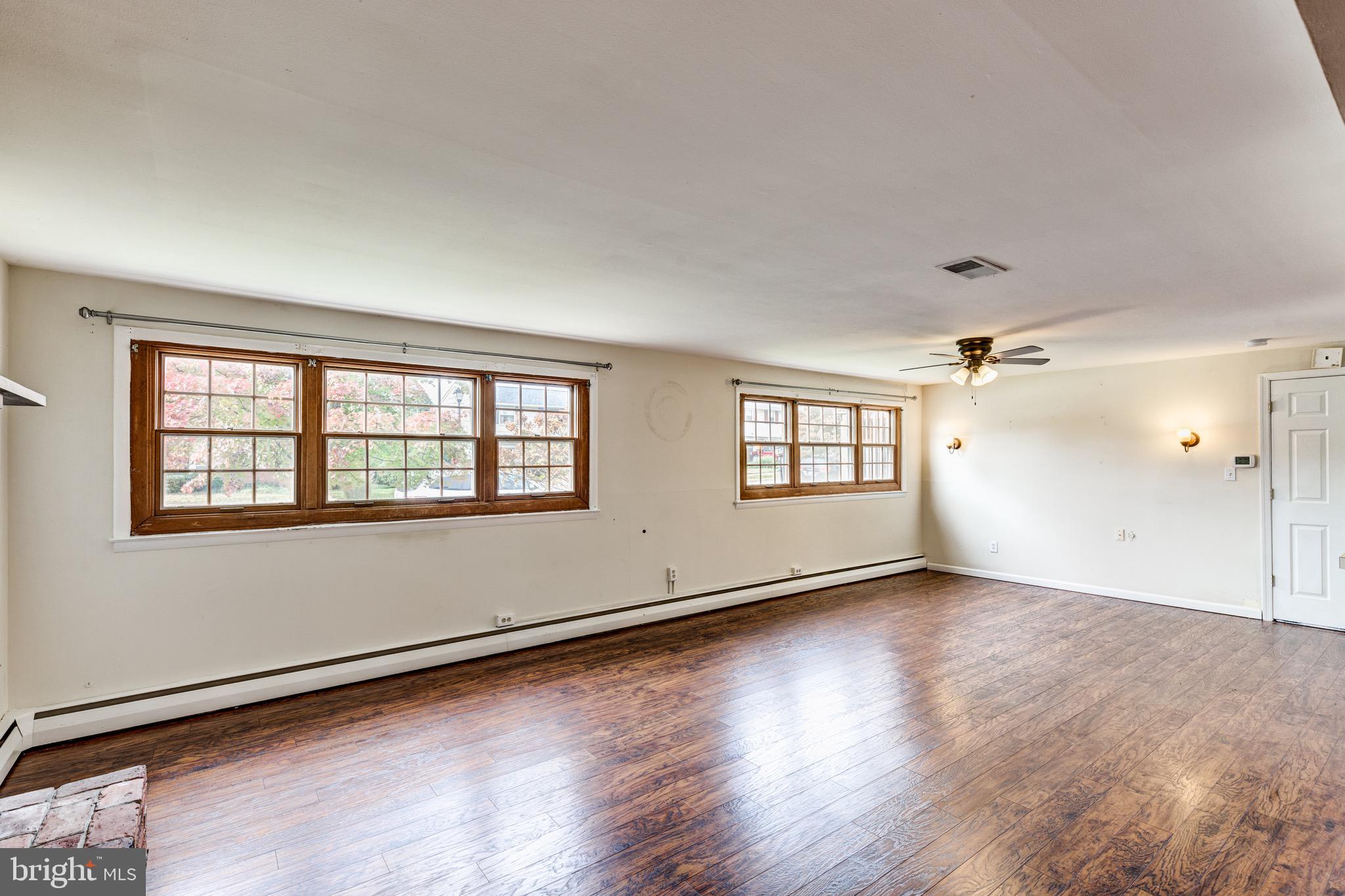2119 Eastridge Road Lutherville-Timonium, MD 21093 - Photo 18 of 39 an empty room with wooden floor and windows