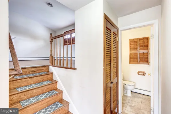 a view of entryway with wooden floor and window
