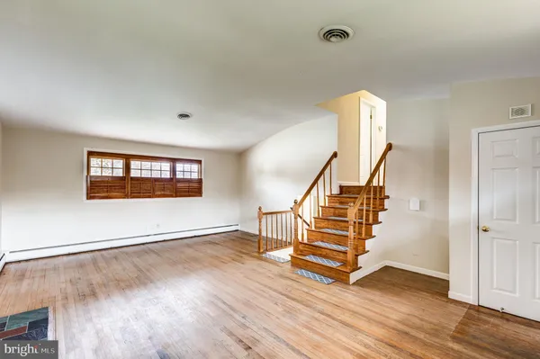 a view of entryway with wooden floor