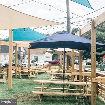 a view of backyard with outdoor seating