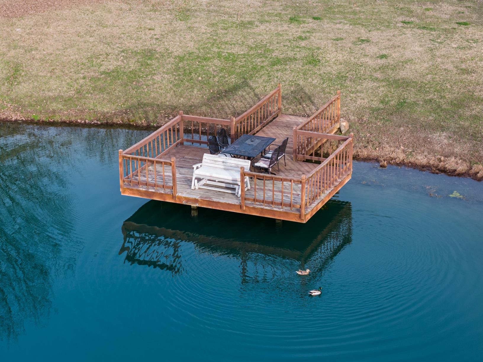 8169 Miller Road Atoka, TN 38004 - Photo 11 of 40 a view of a roof deck with wooden floor and fence