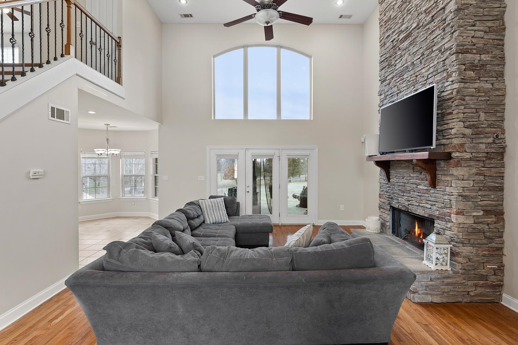 8169 Miller Road Atoka, TN 38004 - Photo 15 of 40 a living room with furniture a fireplace and a flat screen tv