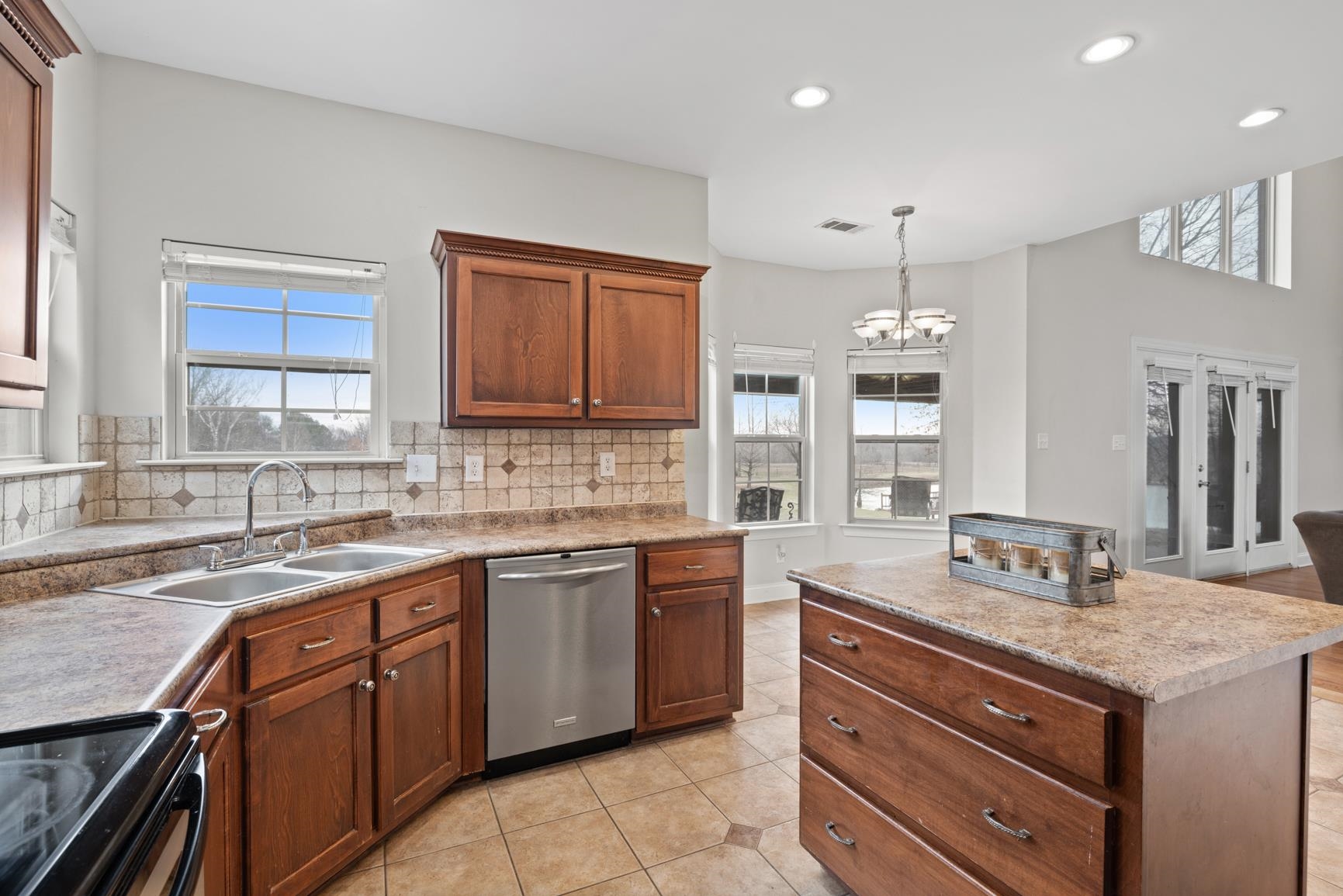 8169 Miller Road Atoka, TN 38004 - Photo 19 of 40 a kitchen with a sink stove and cabinets