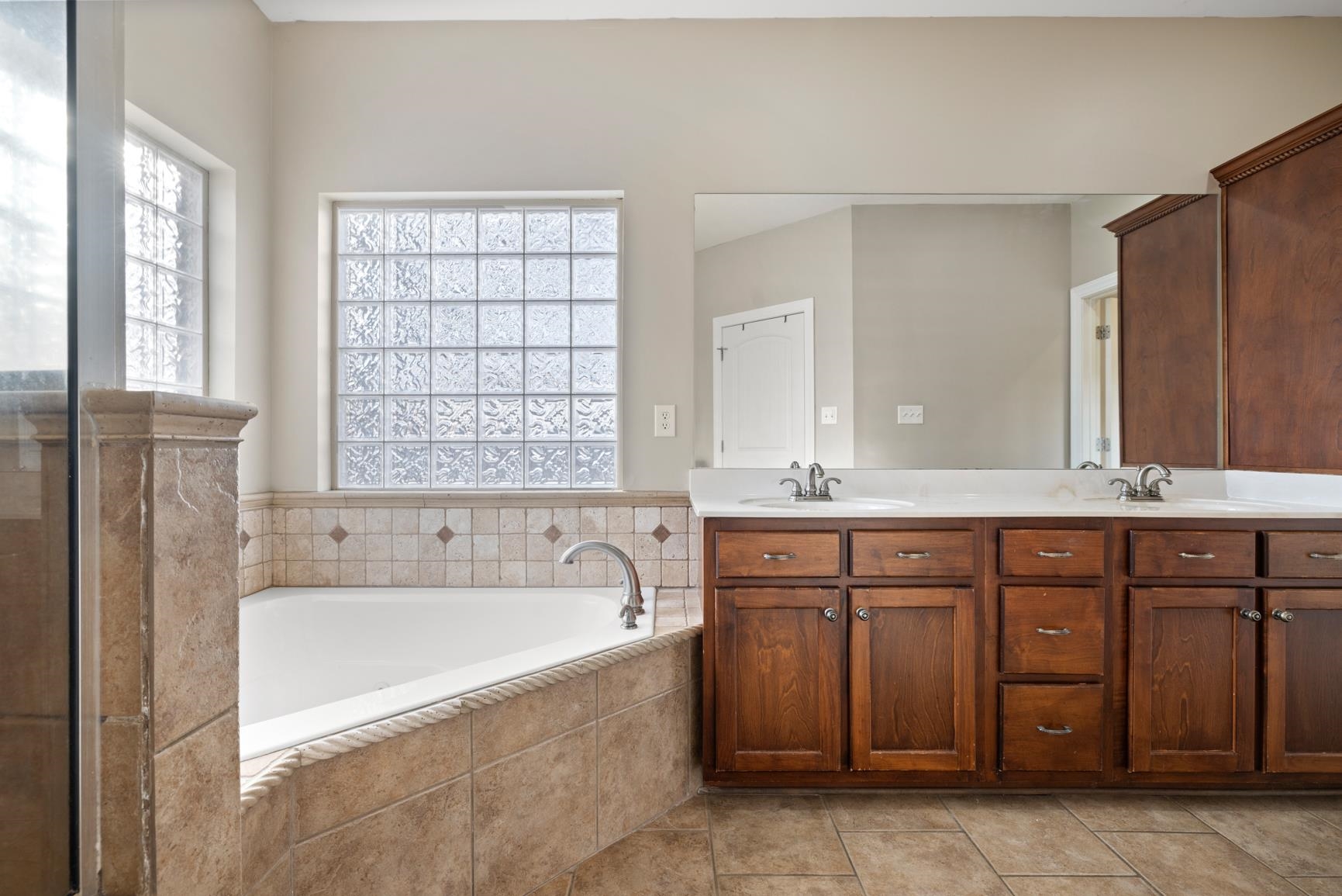 8169 Miller Road Atoka, TN 38004 - Photo 28 of 40 a spacious bathroom with a tub sink and mirror