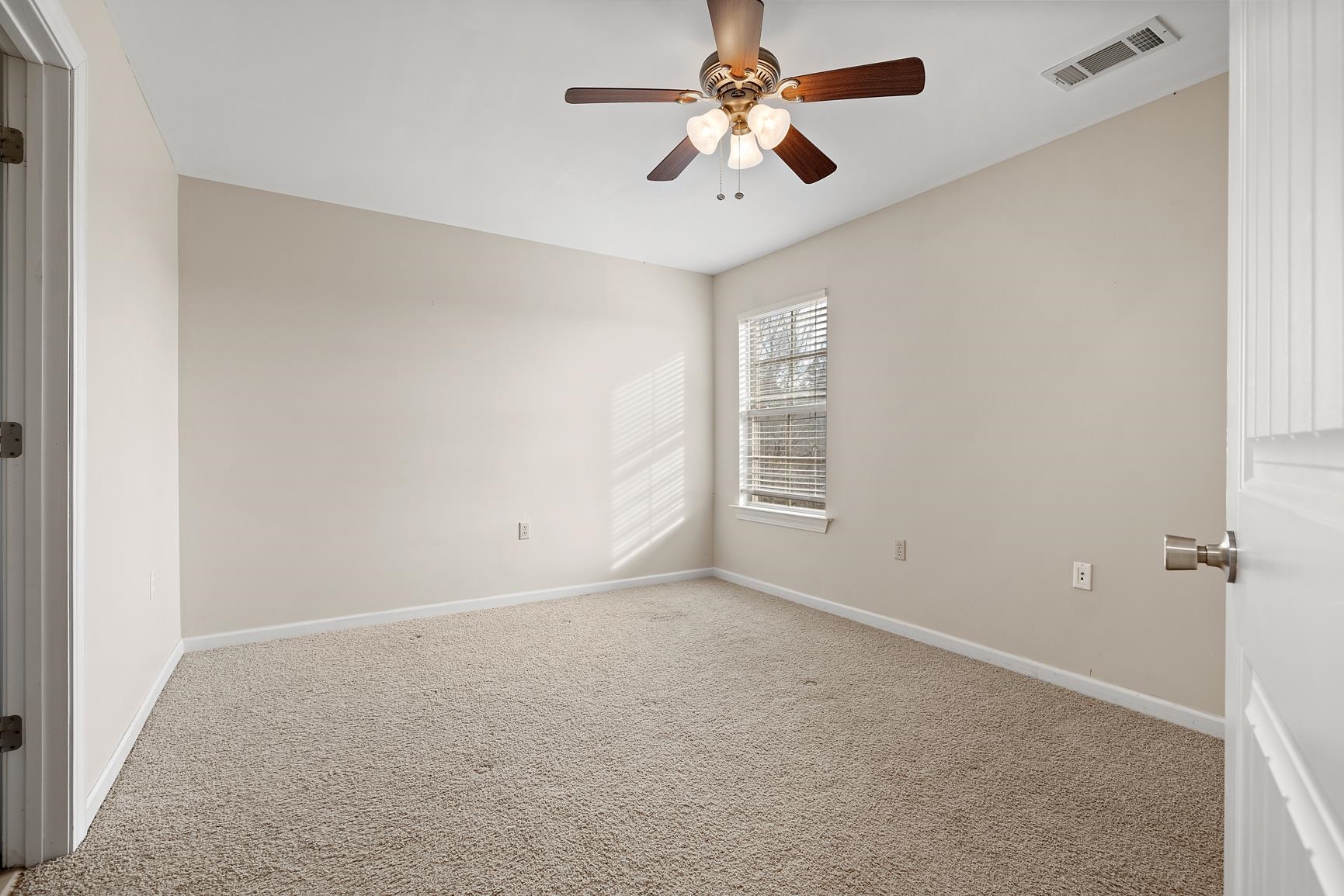 8169 Miller Road Atoka, TN 38004 - Photo 32 of 40 an empty room with windows and fan
