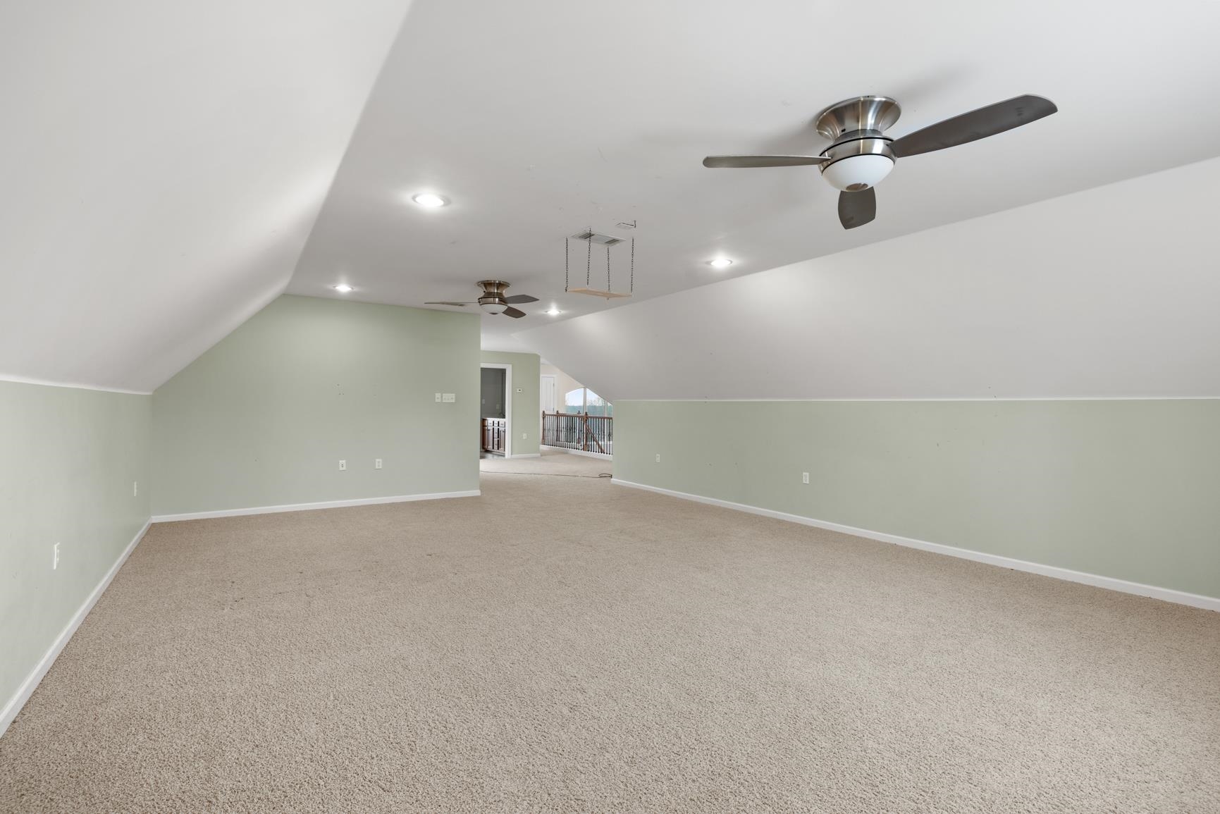 8169 Miller Road Atoka, TN 38004 - Photo 35 of 40 an empty room with a projector and a ceiling fan