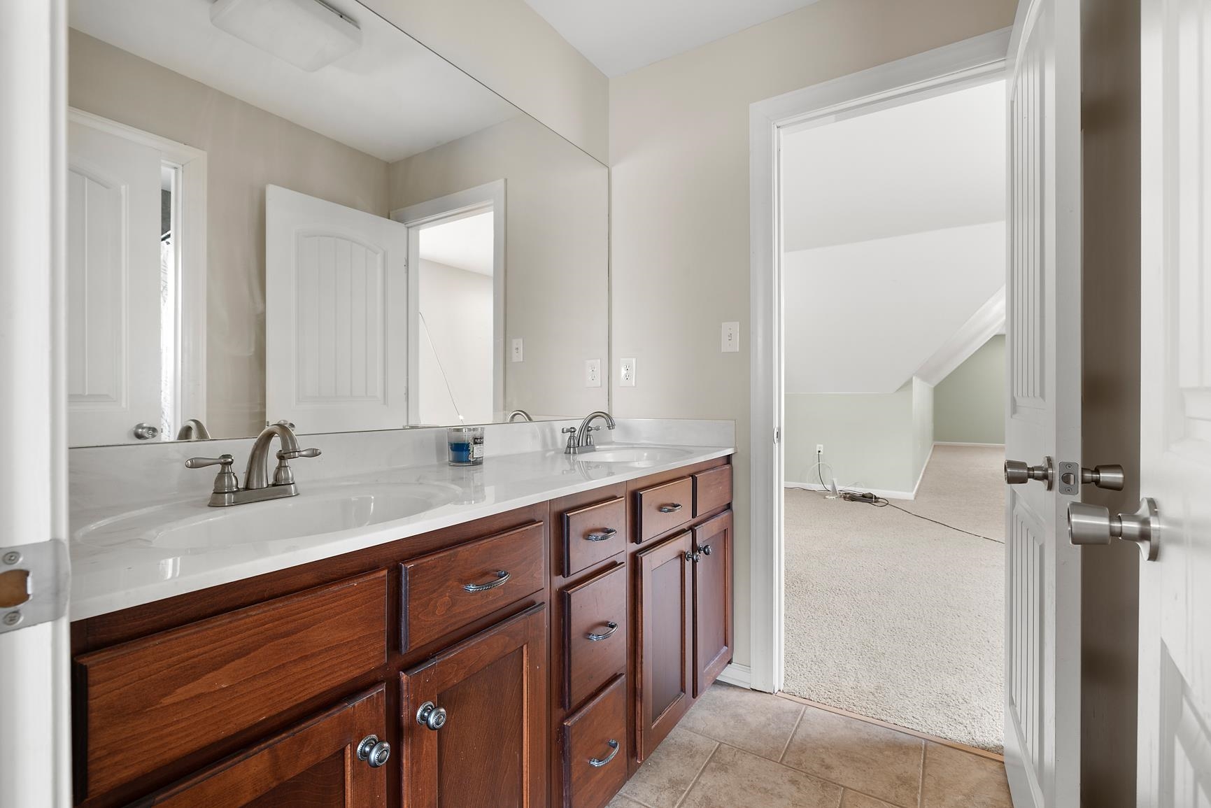 8169 Miller Road Atoka, TN 38004 - Photo 39 of 40 a bathroom with a sink double vanity and a mirror
