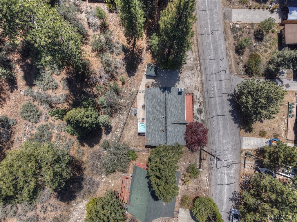 1099 Canyon Road Fawnskin, CA 92333 - Photo 27 of 39 an aerial view of a house with a yard and mountain view in back