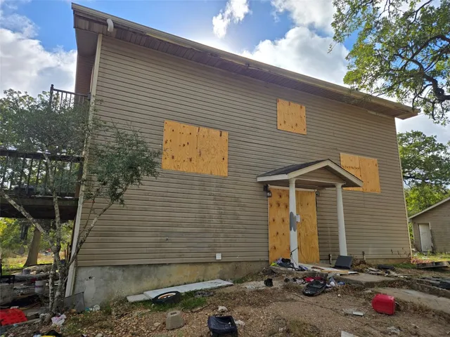 a front view of a house with yard