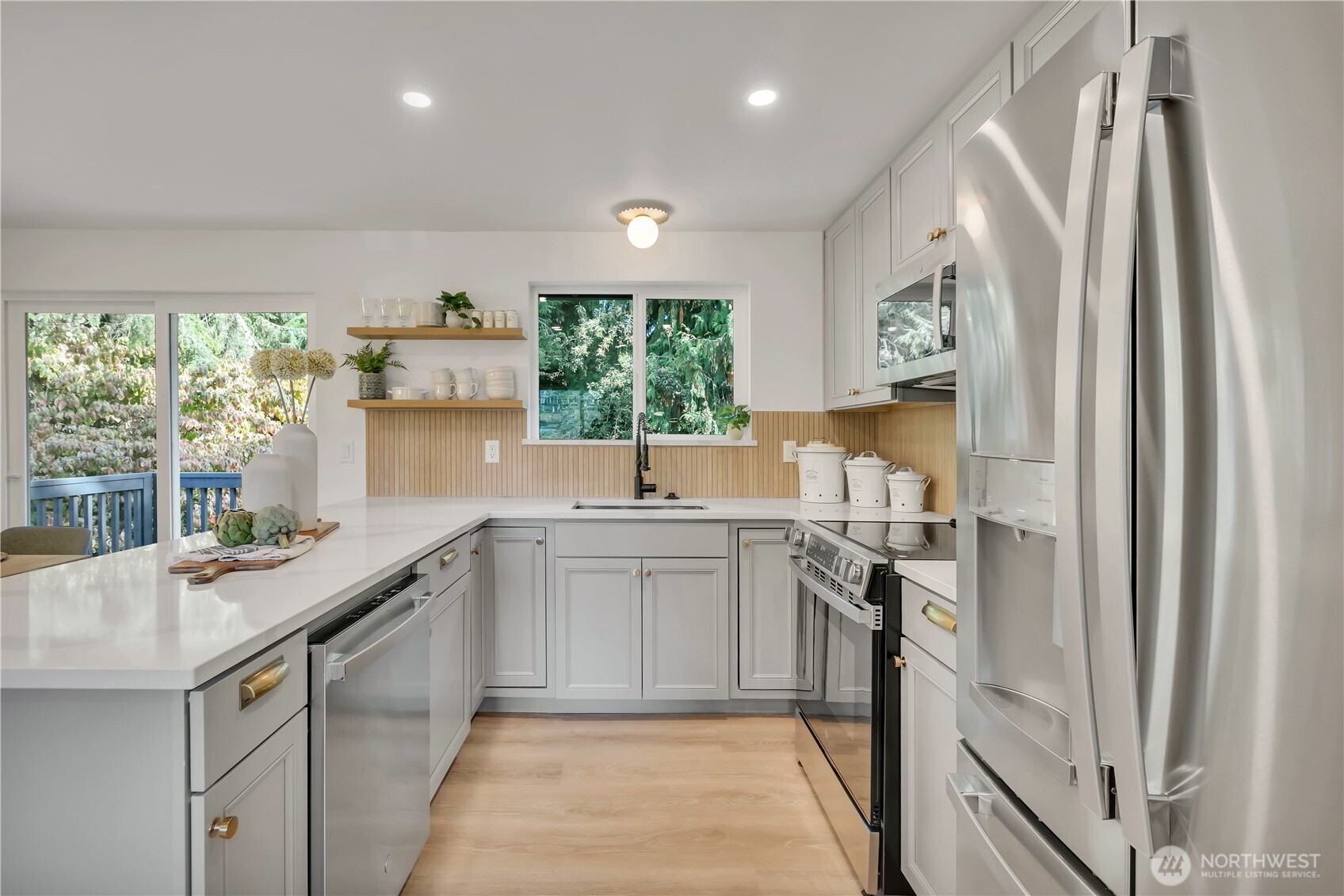 2310 Aberdeen Avenue Northeast Renton, WA 98056 - Photo 13 of 35 a kitchen with a sink stove and refrigerator