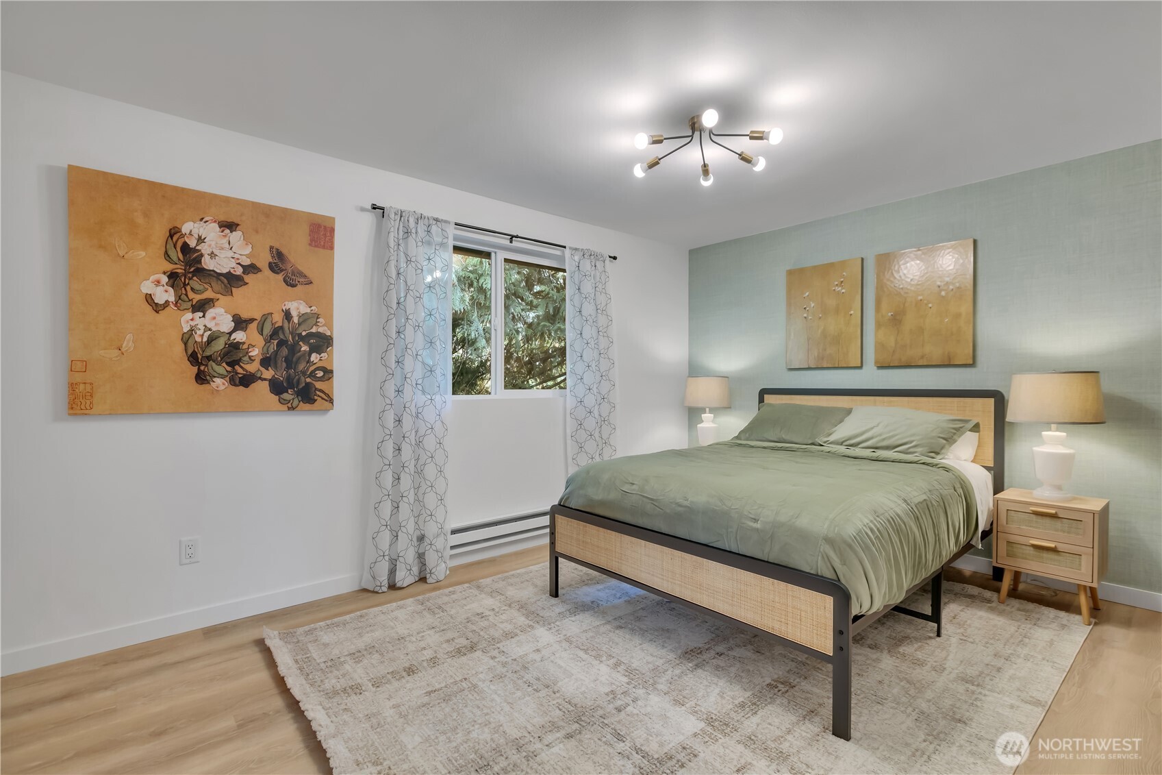 2310 Aberdeen Avenue Northeast Renton, WA 98056 - Photo 15 of 35 a spacious bedroom with a bed and a painting on the wall