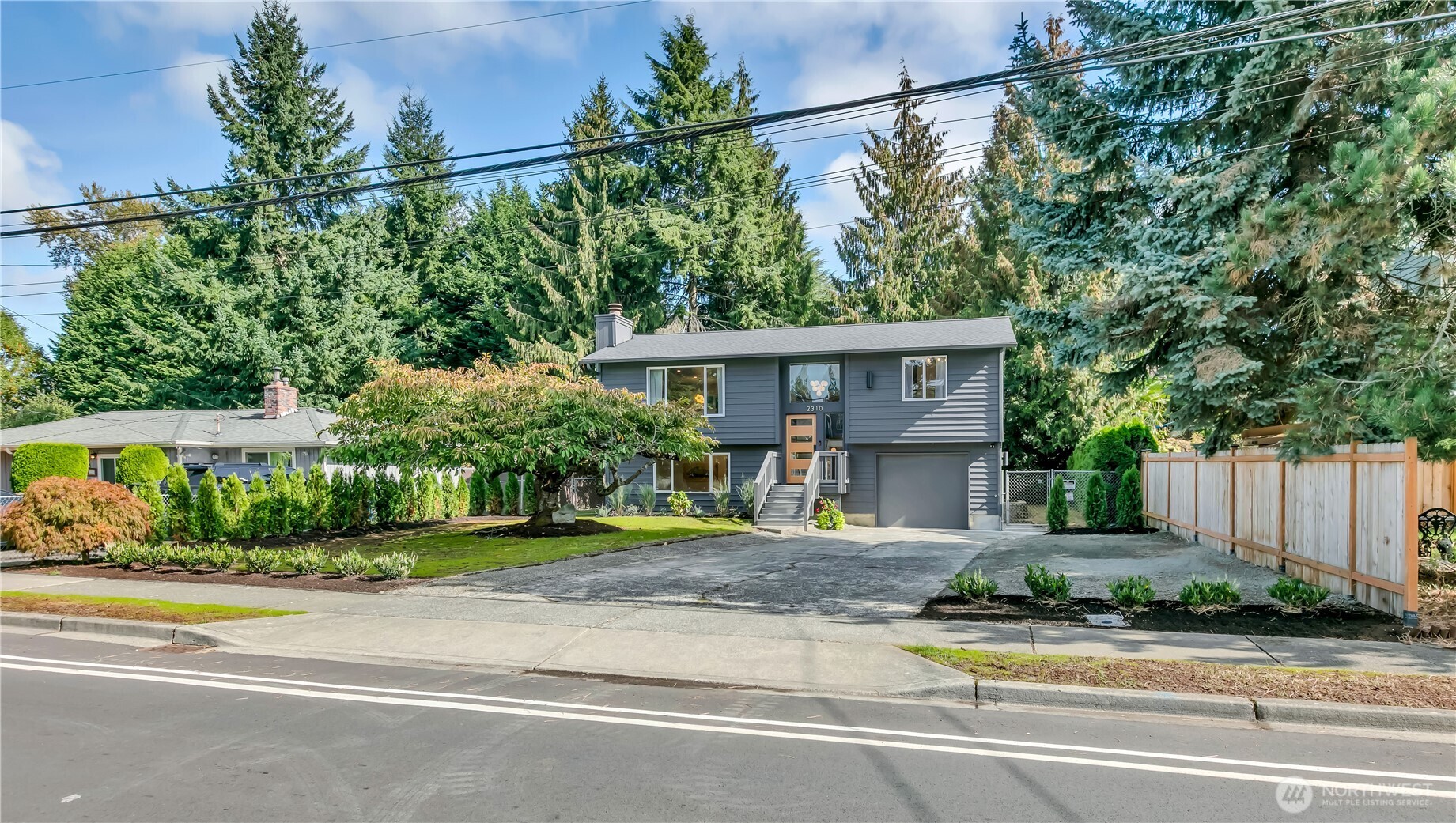 2310 Aberdeen Avenue Northeast Renton, WA 98056 - Photo 2 of 35 a view of a house with a yard plants and large tree