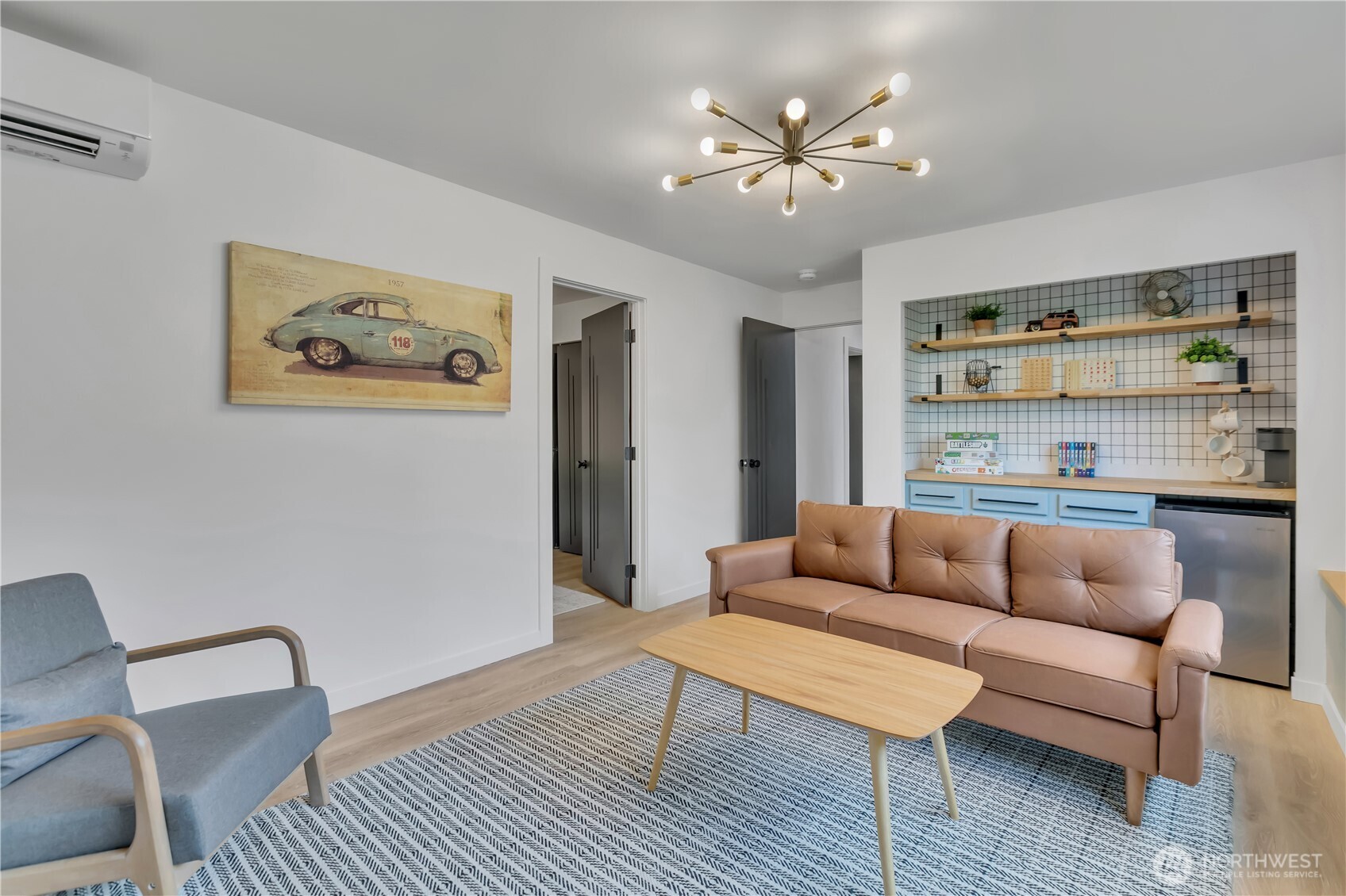 2310 Aberdeen Avenue Northeast Renton, WA 98056 - Photo 23 of 35 a living room with furniture and a wooden floor