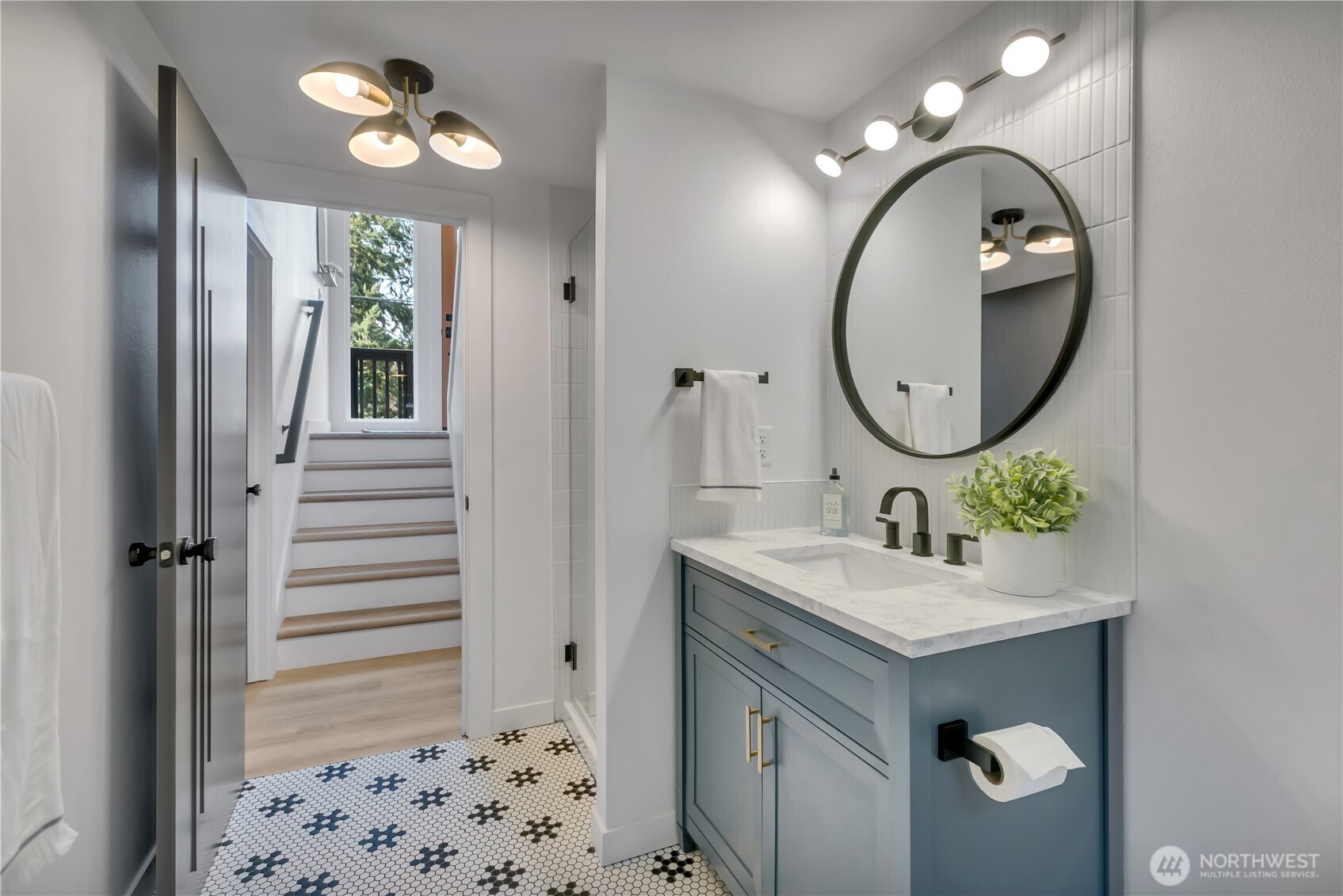 2310 Aberdeen Avenue Northeast Renton, WA 98056 - Photo 29 of 35 a bathroom with a sink and a mirror