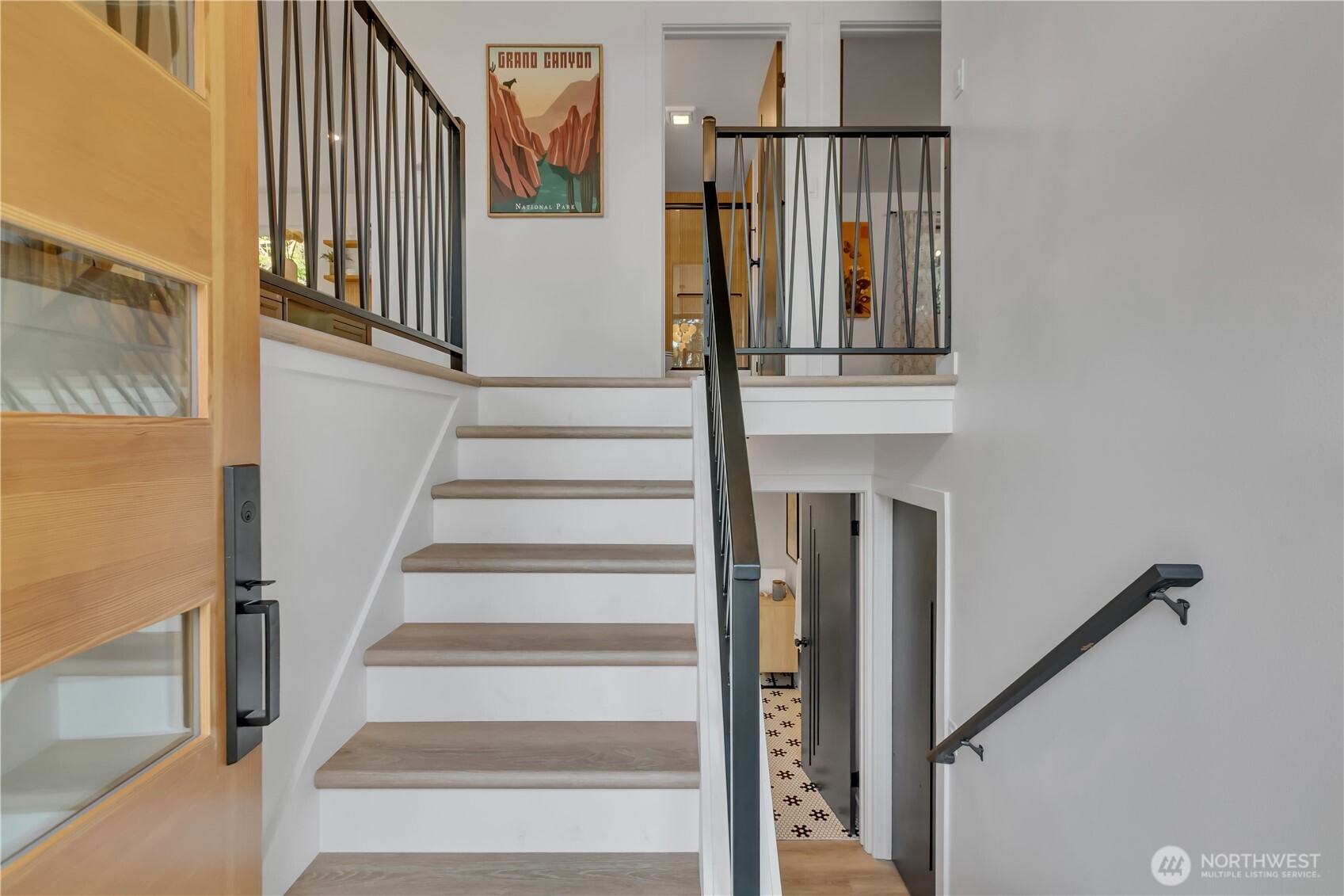 2310 Aberdeen Avenue Northeast Renton, WA 98056 - Photo 3 of 35 a view of staircase with lots of frames on wall and a window