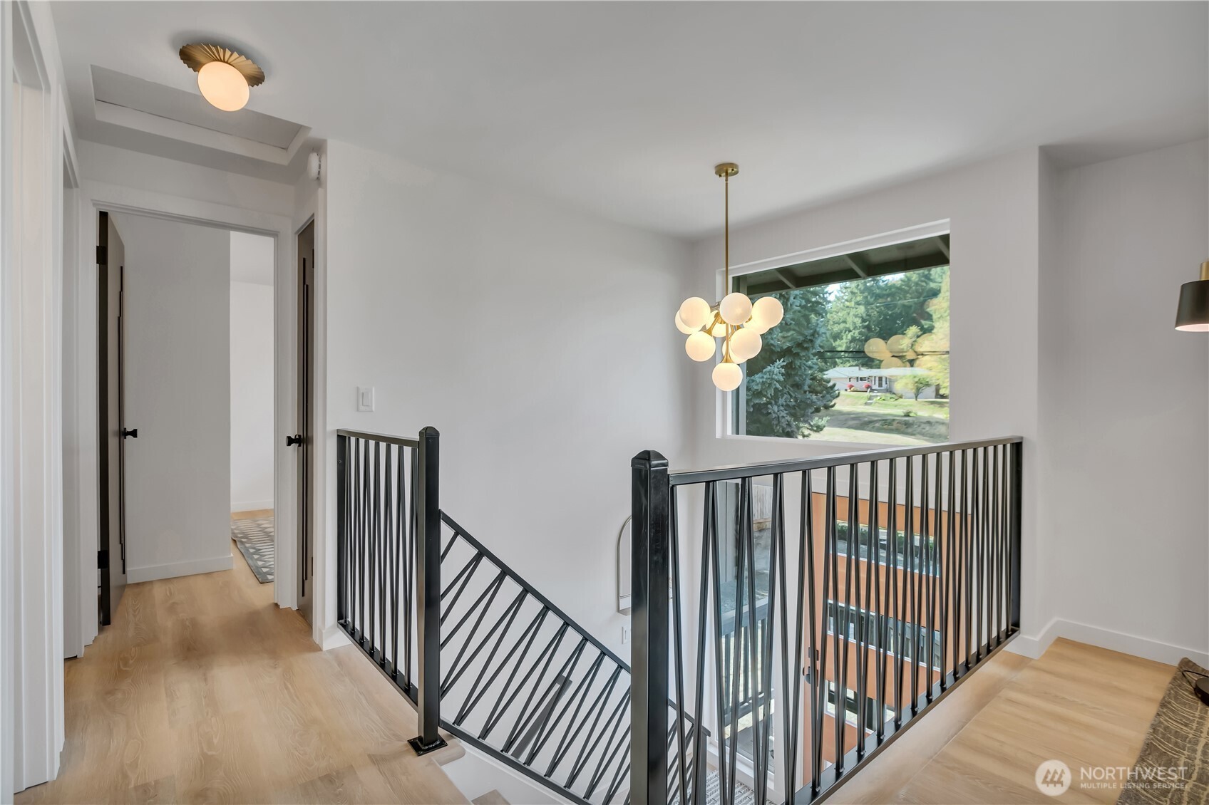 2310 Aberdeen Avenue Northeast Renton, WA 98056 - Photo 4 of 35 a view of a hallway with wooden floor and stairs