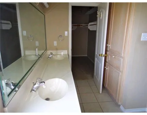 a bathroom with a sink and shower