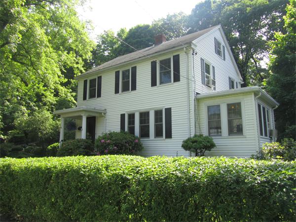 84 Seaver Street Wellesley, MA 02481 - Photo 1 of 13 a view of a yard in front of a white house