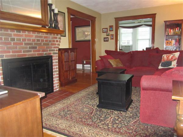 84 Seaver Street Wellesley, MA 02481 - Photo 5 of 13 a living room with furniture a fireplace and a window