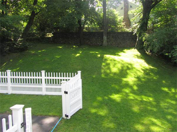 84 Seaver Street Wellesley, MA 02481 - Photo 10 of 13 a view of a bench in the garden