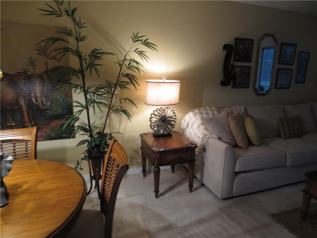 8822 West McNab Road, Unit 205 Tamarac, FL 33321 - Photo 14 of 20 a living room with furniture