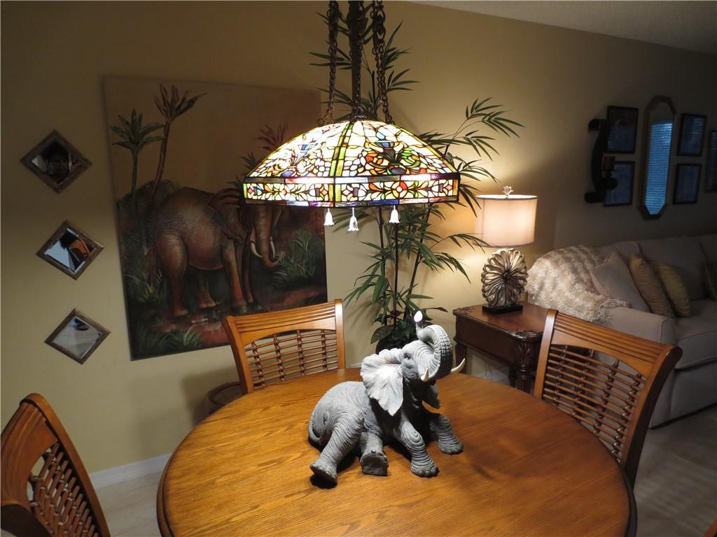 8822 West McNab Road, Unit 205 Tamarac, FL 33321 - Photo 20 of 20 a room with furniture and chandelier