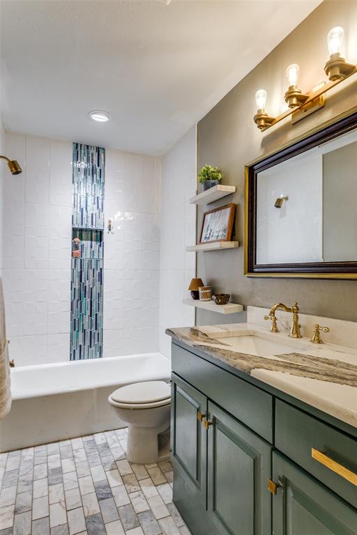 1295 Roaring Springs Road Fort Worth, TX 76114 - Photo 11 of 17 a bathroom with a sink a toilet and mirror