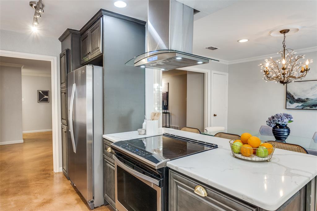 1295 Roaring Springs Road Fort Worth, TX 76114 - Photo 4 of 17 a kitchen with stainless steel appliances granite countertop a sink a stove and a refrigerator