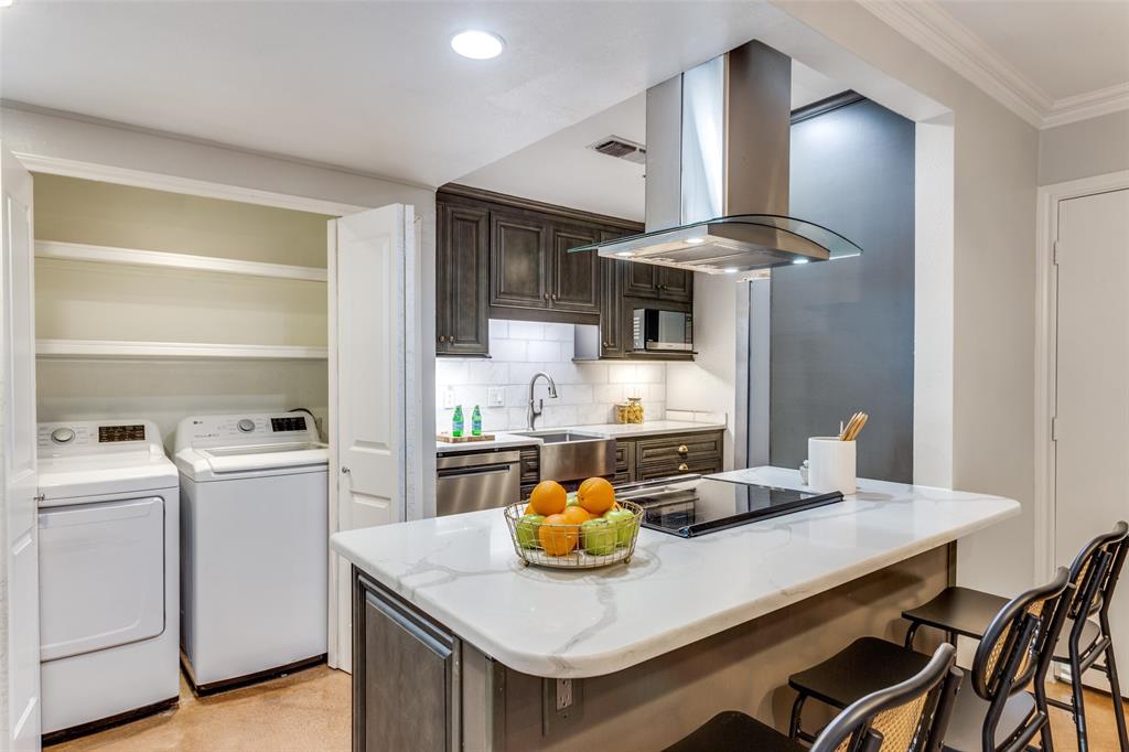1295 Roaring Springs Road Fort Worth, TX 76114 - Photo 5 of 17 a kitchen with stainless steel appliances granite countertop a sink a stove and a wooden floors