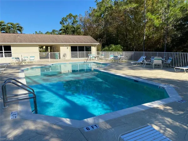 a view of pool with outdoor seating