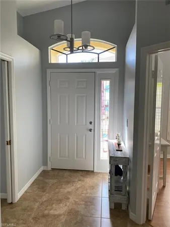 a view of a livingroom with a kitchen