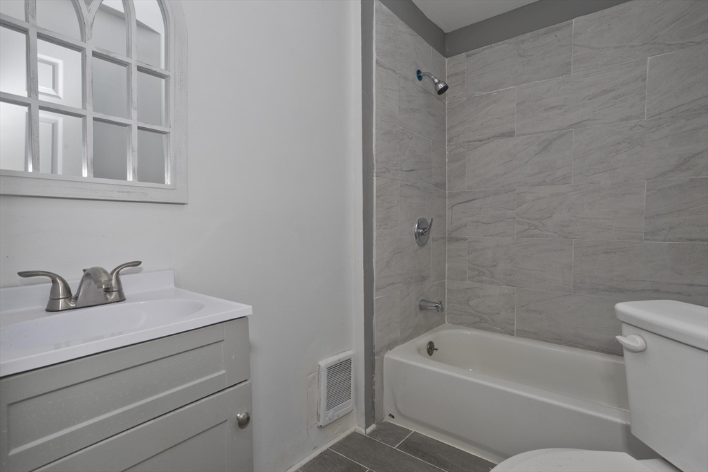 44 Eagle Street Springfield, MA 01107 - Photo 12 of 38 a bathroom with a bathtub and a sink