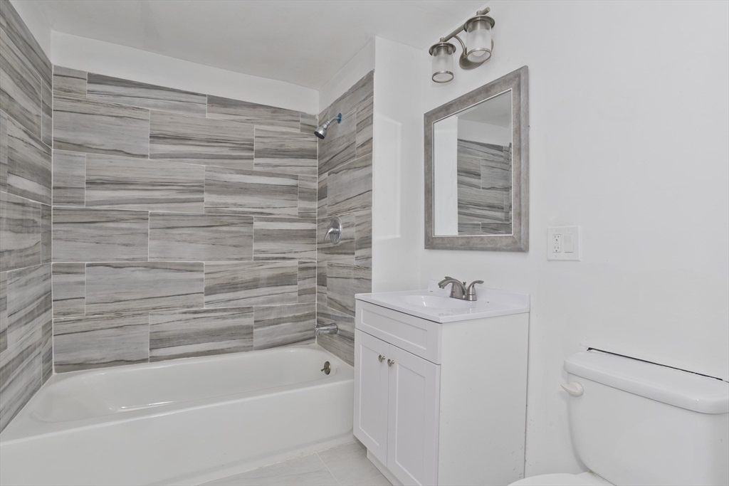 44 Eagle Street Springfield, MA 01107 - Photo 17 of 38 a bathroom with a sink a toilet and shower