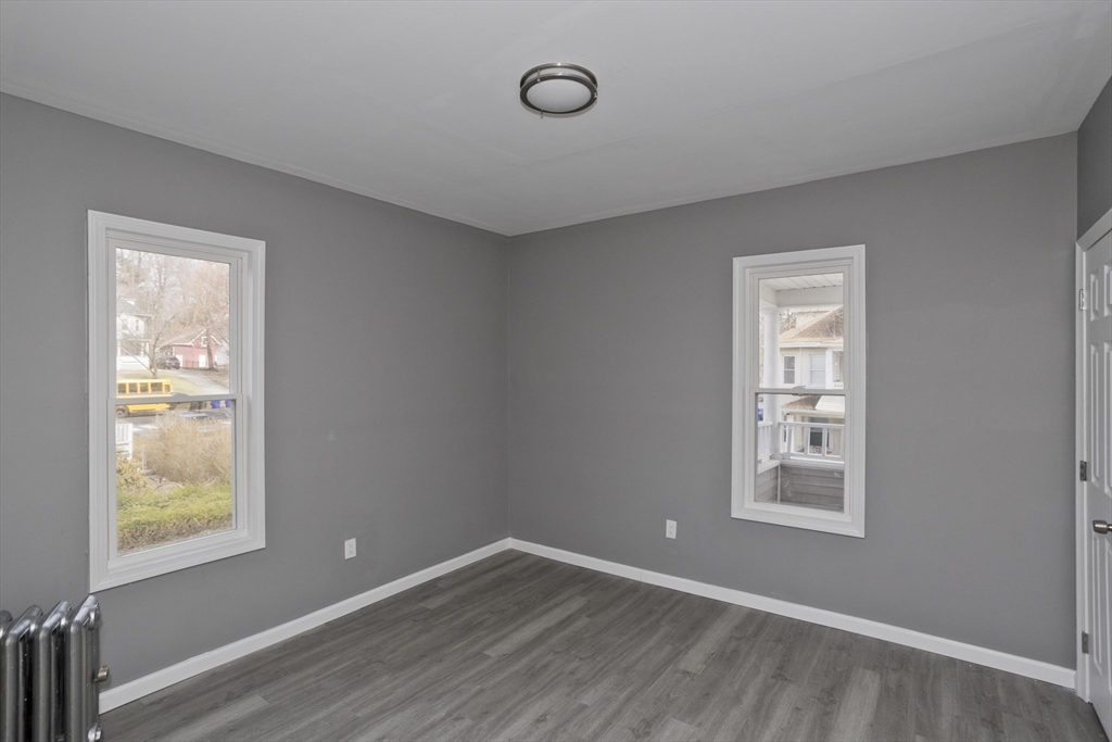 44 Eagle Street Springfield, MA 01107 - Photo 19 of 38 a view of an empty room with window and closet area