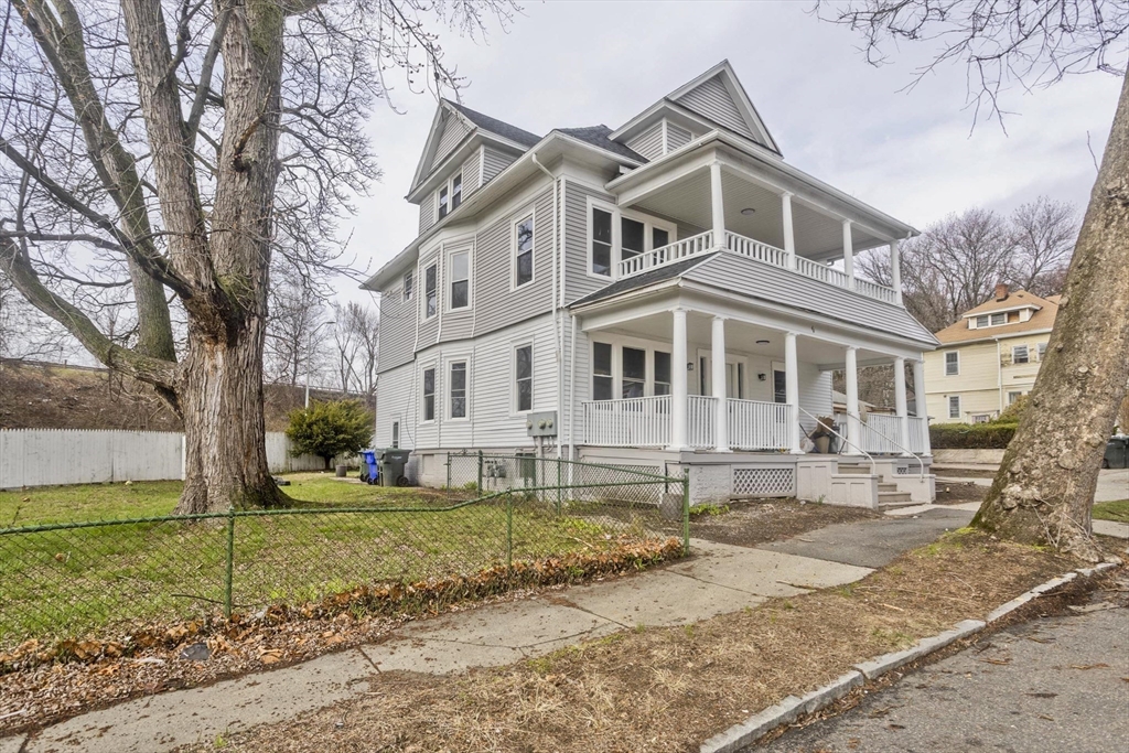 44 Eagle Street Springfield, MA 01107 - Photo 2 of 38 a front view of a house with a yard