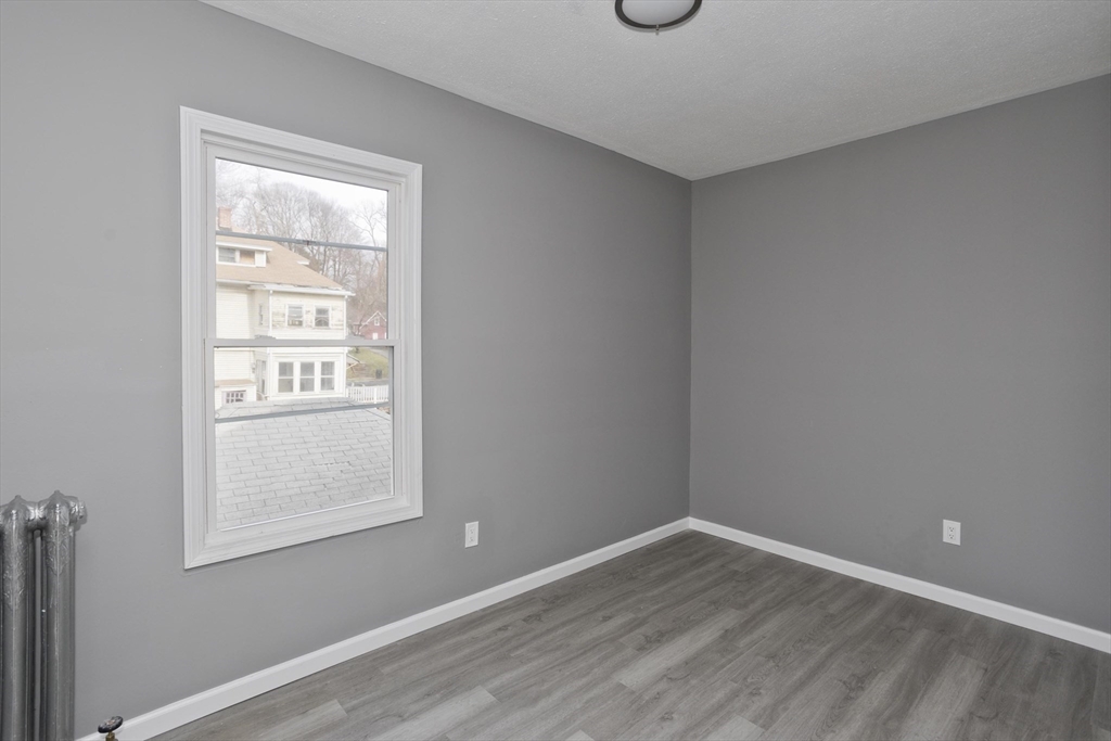 44 Eagle Street Springfield, MA 01107 - Photo 21 of 38 an empty room with a window