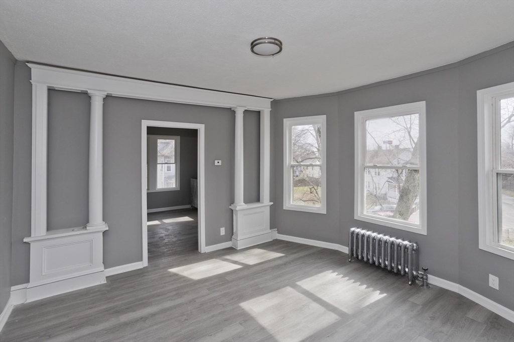 44 Eagle Street Springfield, MA 01107 - Photo 28 of 38 wooden floor and windows in an empty room