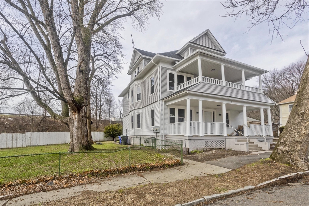 44 Eagle Street Springfield, MA 01107 - Photo 6 of 38 a front view of a house with a yard