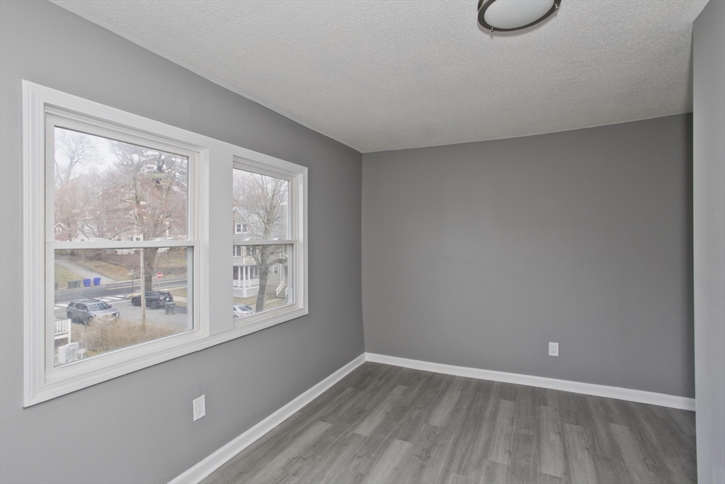 44 Eagle Street Springfield, MA 01107 - Photo 7 of 38 a view of an empty room with a window