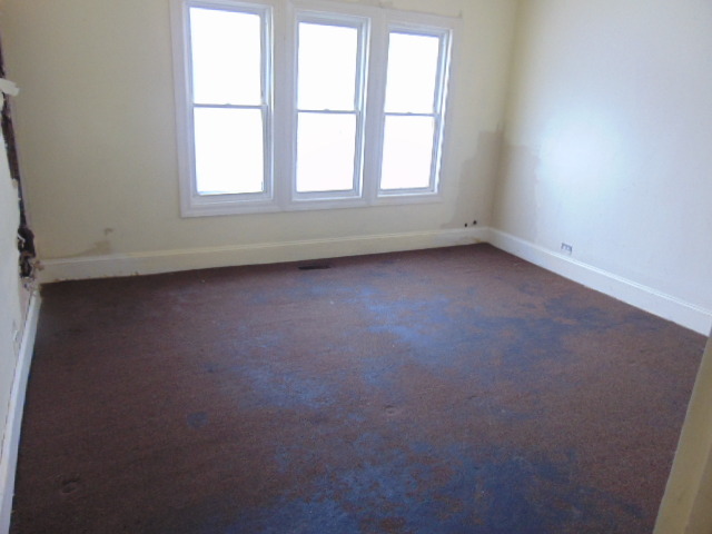 1 East 114th Street Chicago, IL 60628 - Photo 7 of 12 an empty room with a window