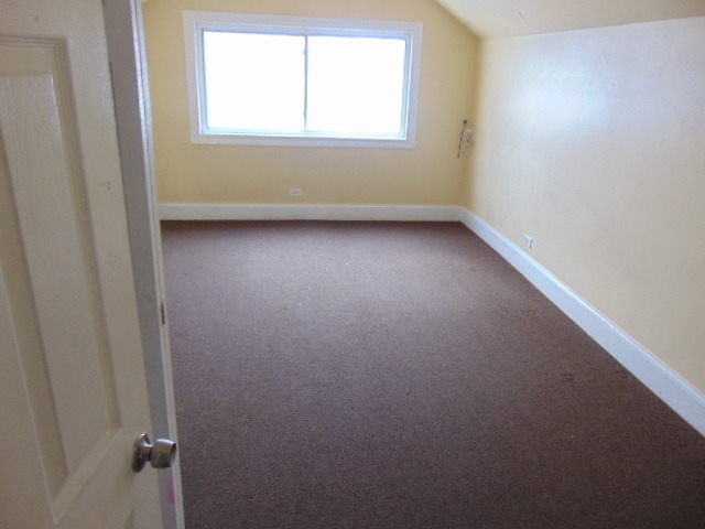 1 East 114th Street Chicago, IL 60628 - Photo 8 of 12 an empty room with a window