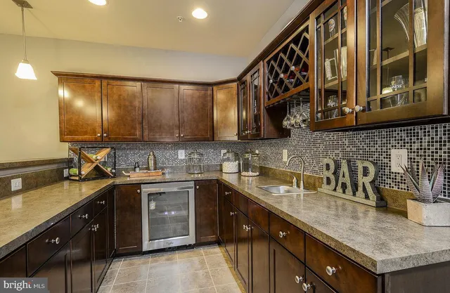 a kitchen with a sink and cabinets