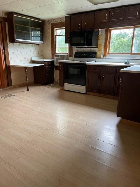 115 Alpine Lane Butler, PA 16001 - Photo 3 of 21 a kitchen with stainless steel appliances granite countertop a stove a sink and a microwave