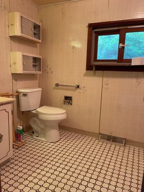 115 Alpine Lane Butler, PA 16001 - Photo 5 of 21 a bathroom with a sink and a toilet