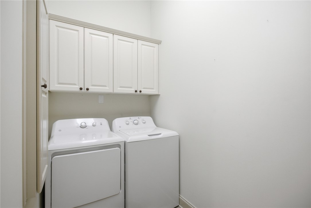 130 River Ridge Road Sunset, SC 29685 - Photo 31 of 47 This dedicated laundry space features practical cabinetry for storage and efficient appliances.
