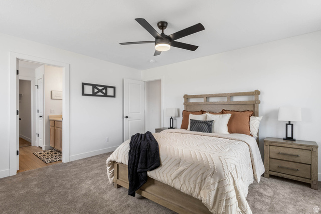 636 West Caroles Way, Unit 7 Tooele, UT 84074 - Photo 24 of 31 Bedroom with plush gray carpeting and white walls