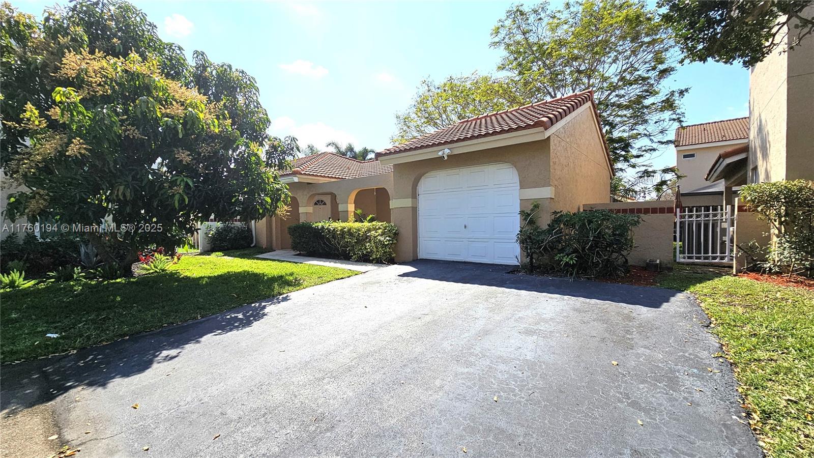 1350 Seagrape Circle Weston, FL 33326 - Photo 1 of 22 a view of a house with yard and tree s