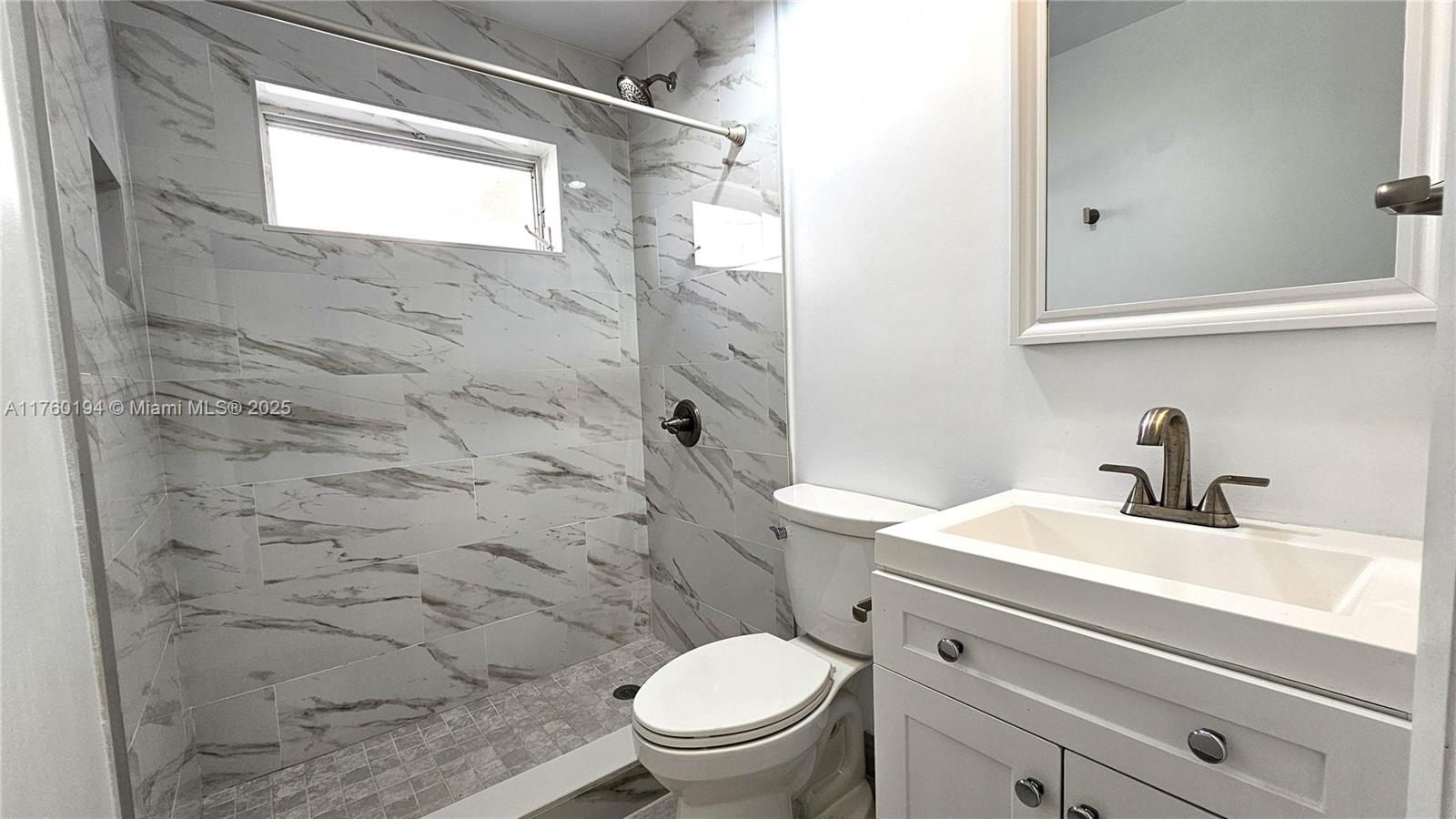 1350 Seagrape Circle Weston, FL 33326 - Photo 11 of 22 a bathroom with a granite countertop sink a toilet and shower
