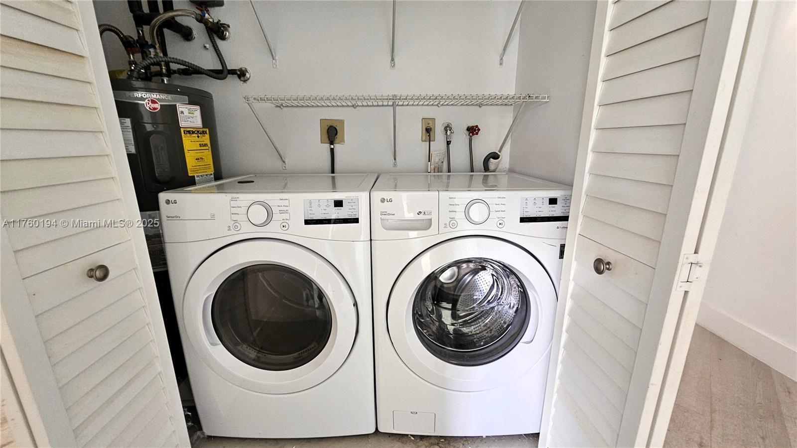 1350 Seagrape Circle Weston, FL 33326 - Photo 14 of 22 a utility room with dryer and washer